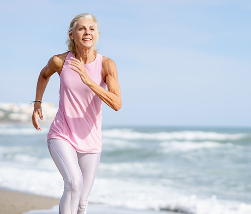 Woman running on the beach near Sebastian Florida