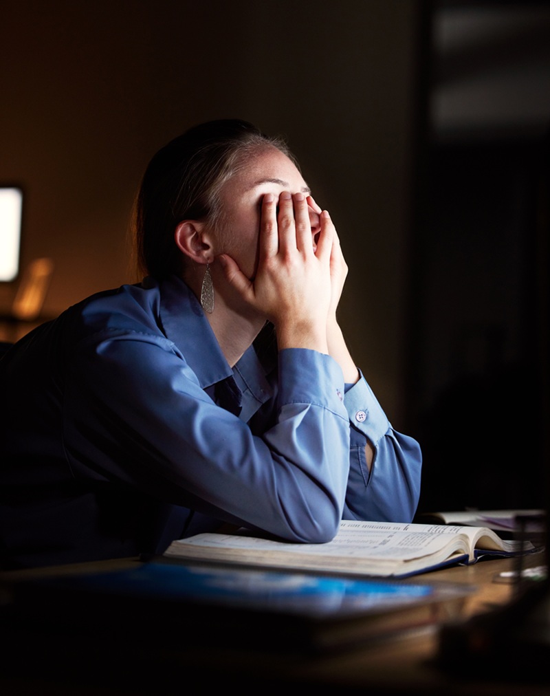 Business woman, headache and exhausted with burnout and working night, stress migraine and mental h.